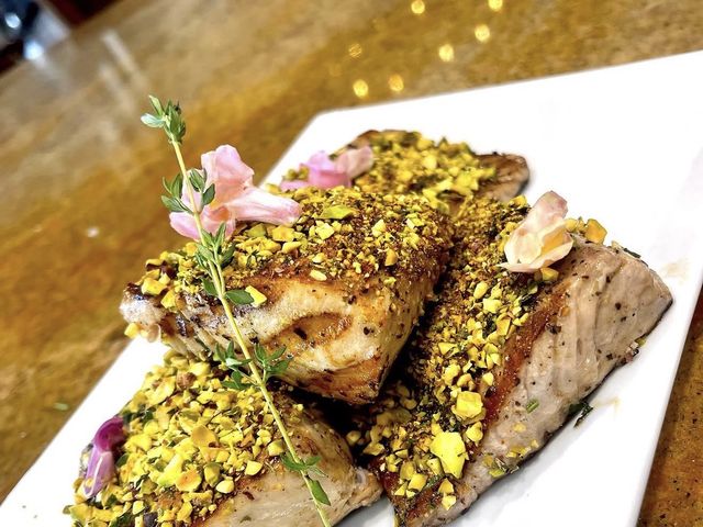 Pistachio-crusted fish with edible flowers — Private Chef Los Cabos